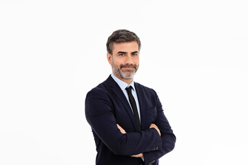 Businessman smiling with arms crossed on white background