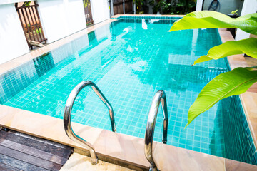 Swimming pool with clean water, water treatment and pool service concept, Asian style architecture design idea