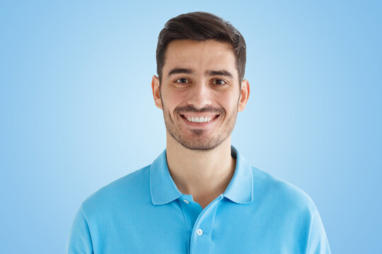 Portrait of smiling handsome man in blue polo shirt