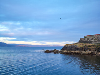 Fototapeta na wymiar Sunset on the coast, a picture postcard image