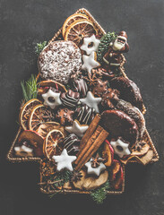 Christmas tree made with various pastry, cookies, gingerbread, chocolate and winter spices. Top view