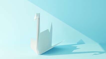 paper figurine of origami swan illuminated by a beam of light on a blue background