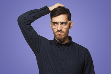 Pensive businessman thinking, scratching his head trying to find solution