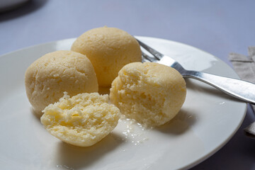 Indian dessert in syrup rasgulla, popular in the Bengal region of India, served in a glass dish. Also knoiwn as Rasagola, Rosogola or Rosogolla