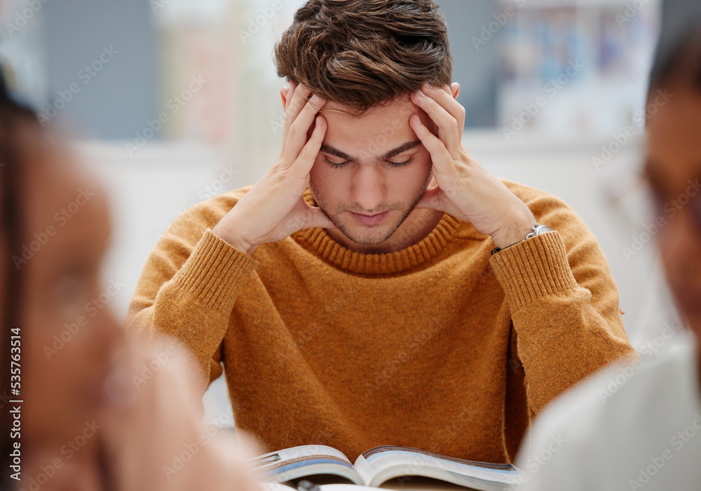 Poster Study, stress and student at university with anxiety for a test. Young man with headache, worried and studying with textbook on desk in library. Tired in education, learning and stressed about exam