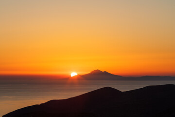 Amazing colourful sunset from Folegandros Island with the Aegean sea. Cyclades of Greece.