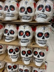 a group of sculls decoration in supermarket. for halloween or day of dead. vertical