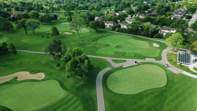 Aerial drone tilt down shot over a Golf Club in Northbrook, Illinois, USA at daytime.