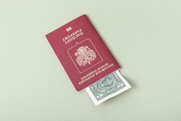 Russian foreign passport and one dollar on green background. Money exchange