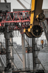 Yellow industrial crane in the seaport	
