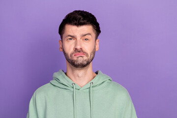 Closeup photo of young sad unhappy bearded man brunet pouted lips problems bored his work suspicious isolated on bright violet color background