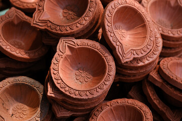 diya or clay lamp at market during Diwali festival in India.