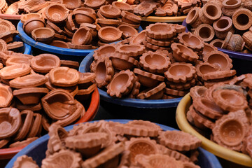 diya or clay lamp at market during Diwali festival in India.