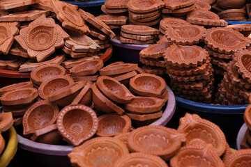 diya or clay lamp at market during Diwali festival in India.