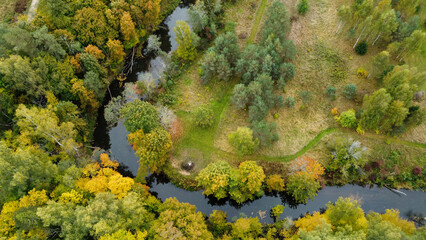 forest and river at sunset in autumn. Aerial view of wildlife in Latvia, Europe