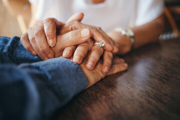 Trust, love and old couple holding hands to support each other in marriage, life and retirement with empathy. Gratitude, understanding and elderly woman comforting her senior partner with sympathy