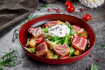 Strachatella. Sea fresh green salad mix with tuna, poached egg, cherry tomatoes and potatoes.