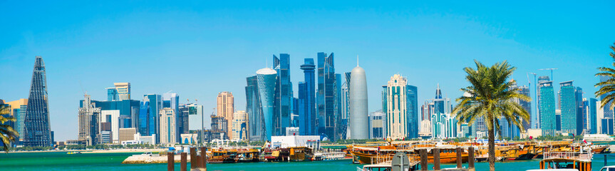 City of Doha panorama with skyscrapers of West Bay downtown district, gulf and Al Corniche road...