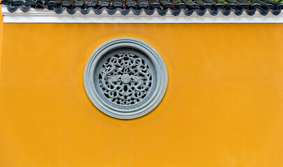 Chinese round window with dragons