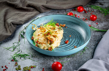Hazelnut risotto on a gray stone table