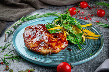 Chicken fillet in rich sauce with vegetables, sesame seeds and herbs