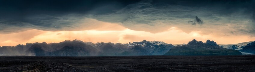 Dramatic of mountain range with asperlitas cloud and sand storm on lava field in summer at Iceland