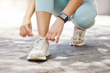 City, fitness and woman tie shoes in street preparing for workout, training or running. Wellness,...