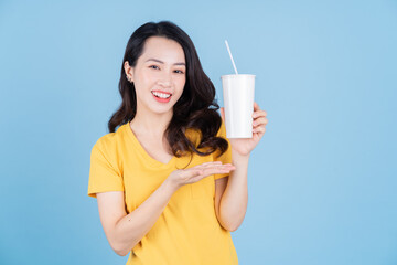 Image of young Asian woman holding a cup of bubble tea