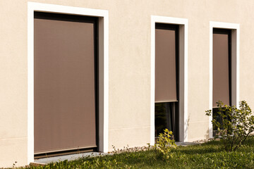 Shutters Roller Outdoor. Floor-to-ceiling Windows Closed with Shutter. External Fabric Roller...