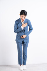 Full length photo of young Asian business woman on background