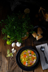 Hearty rustic pea soup with bacon and sausage