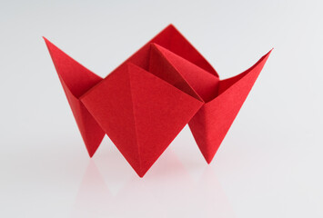 Origami paper fortune on white background