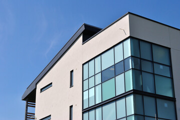 Fototapeta premium Modern Office Building seen against Blue Sky