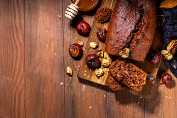 Homemade chestnut cake, sweet vegan chocolate chestnut brownie bread with honey and caramel sauce