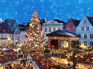  Christmas tree on market place in  snowy Tallinn old town hall square holiday travel to Estonia...