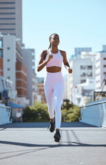 Fototapeta premium Black woman, city running and cardio fitness training, workout and exercise in urban city outdoors. Focus, motivation and wellness of strong, healthy and african sports runner athlete sprint in town