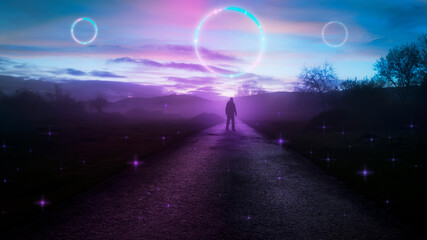 A fantasy concept of a man standing on a path in the countryside in winter at sunset. With glowing portals of light floating in the sky.