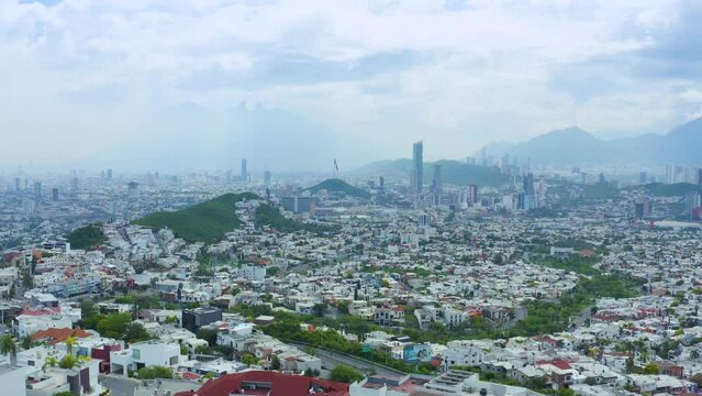 Drone view of Monterrey city skyline in Nuevo Le&oacute;n M&eacute;xico. Video of famous Cerro de la Silla, San Pedro Garza Garc&iacute;a and Mexican Flag.