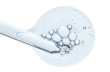 Pipette and a drop of cosmetic serum for the skin. Liquid body care product. Macrophotography....