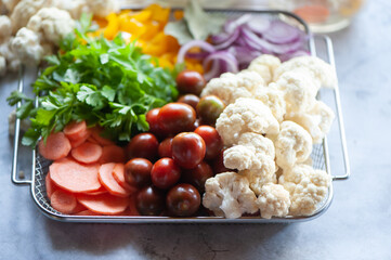 Fermentation of cabbage cauliflower concept, pickles. Cabbage inflorescences in a jar  and other vegetables peppers, carrots and tomatoes, preparation for fermented