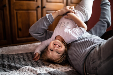 Father playing and joking with his daughters in bedroom
Cozy time wih father
Father daughter time