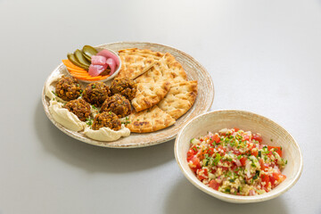 Falafel served with bread and vegetables