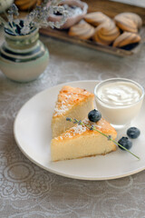 Cheesecake with fresh blueberries on a served table