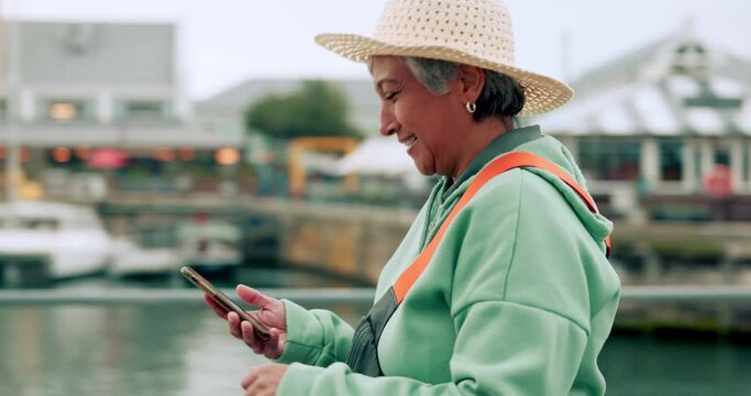 Travel, gps and search with old woman and phone on retirement on Berlin vacation following map, location and internet app. Network, technology and compass with elderly tourist on holiday journey
