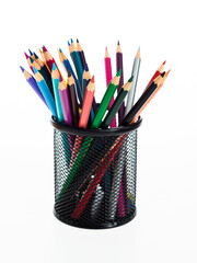 Colorful pencils in metal basket on white background