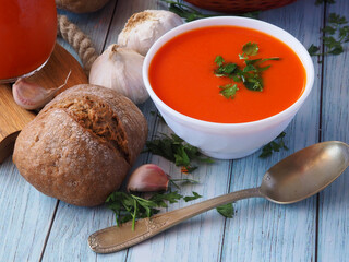 White bowl with tomato puree soup