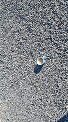 Blue coffee cup with fresh coffee stands on the floor,