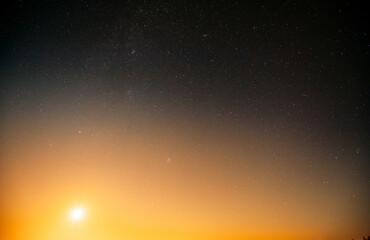 Natural real night sky stars background. Natural starry sky and sun background backdrop. Sunset,...