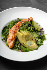 Baked red fish steak with green lettuce