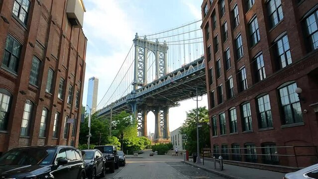 Walking Along Washington Street In The Dumbo Neighborhood Of Brooklyn With Manhattan Bridge View In New York, USA. Dolly Shot
